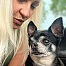 woman, dog, pet, blonde_hair, red_harness, portrait, outdoor, closeup, animal, face, friendship, expression, leisure, candid, human, canine, love, nature, companion, bond
