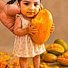 toddler, child, mango, fruit, messy, juice, hand, barefoot, dress, smiling, cute, food, orange, yellow, background, floor, skin, holding, standing, playful