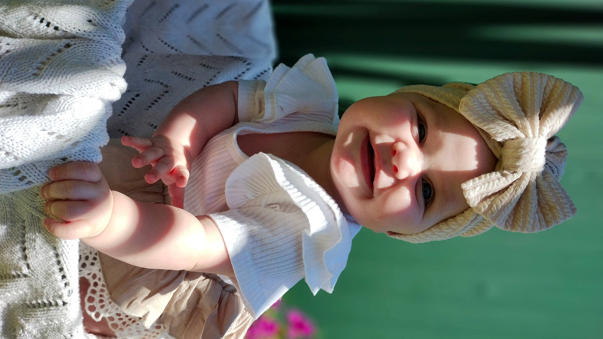Estella is registered to the contest to win money with this photo: baby, beauty, child, fashion_accessory, finger, fun, gesture, grass, hand, happy, hat, headgear, headwear, interaction, people_in_nature, person, plant, skin, smile, toddler