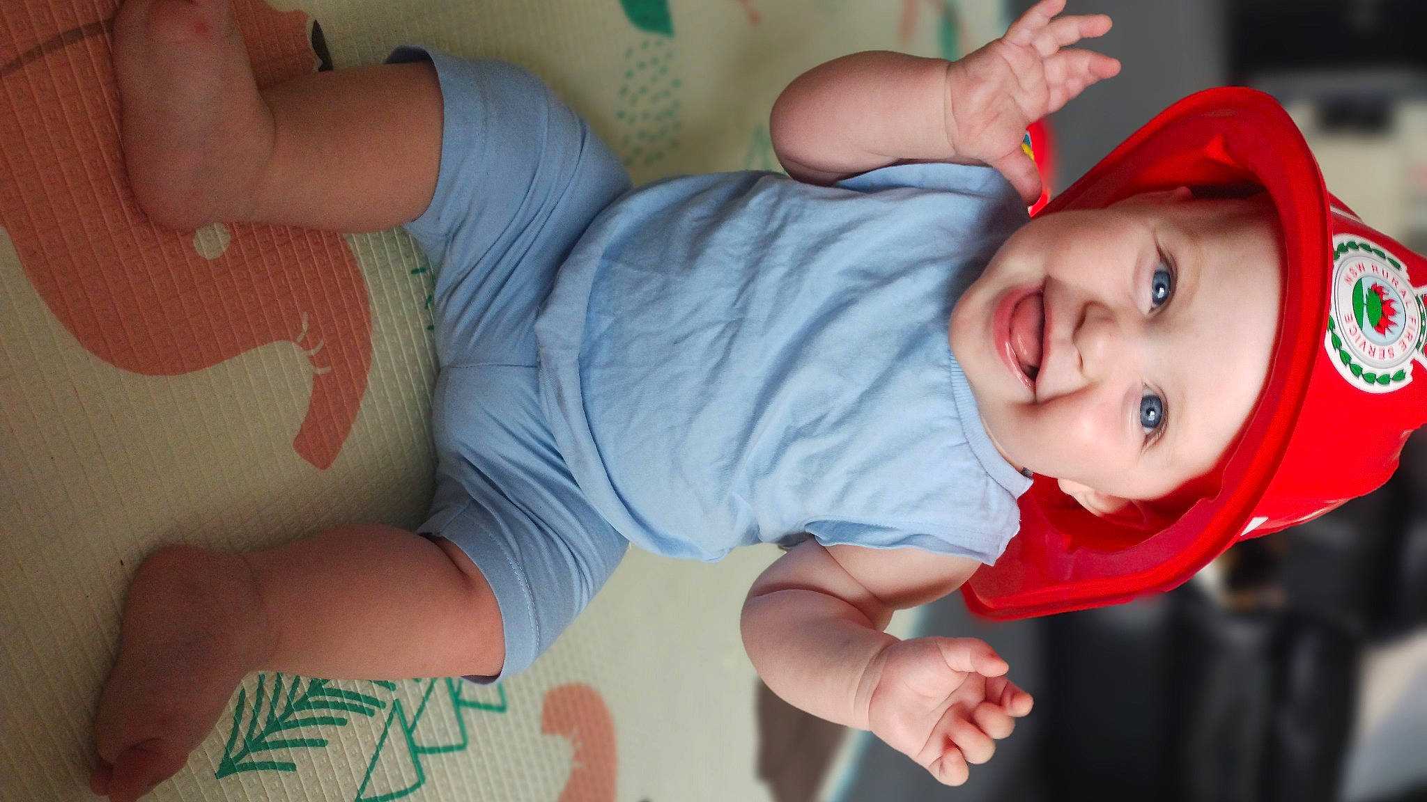 Estella is registered to the contest to win money with this photo: baby, baby_toddler_clothing, cheek, child, comfort, elbow, gesture, happy, hat, headwear, human_body, joy, knee, lip, mouth, nose, person, skin, sleeve, smile