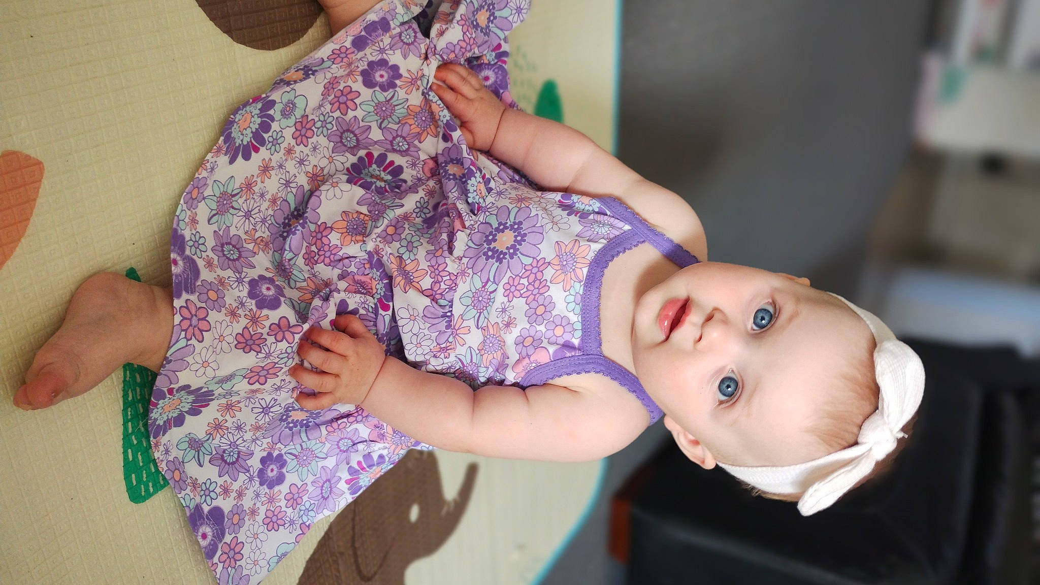 Estella is registered to the contest to win money with this photo: baby, baby_toddler_clothing, child, finger, flash_photography, fun, gesture, hairstyle, hand, happy, human_body, joint, pattern, person, purple, shoulder, skin, sleeve, textile, toddler