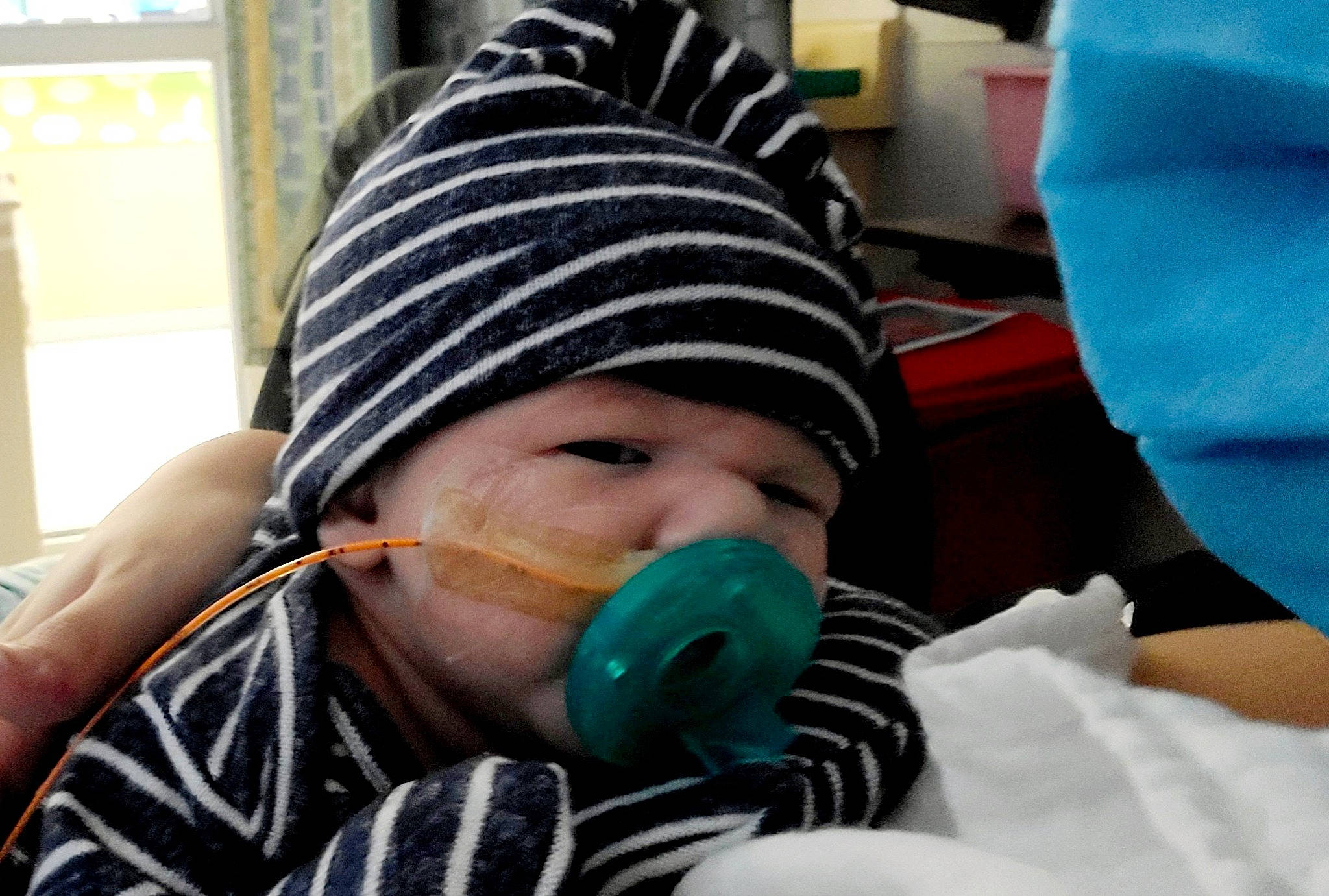 Giovani is registered to the contest to win money with this photo: audio_equipment, baby, baby_toddler_clothing, beanie, cap, cheek, child, comfort, eyewear, fashion_accessory, fun, hearing, knit_cap, person, personal_protective_equipment, polar_fleece, toddler