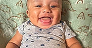 Kirk Jr joined the competition — help win amazing prizes! apparel, baby, blanket, child, clothing, cute, denim, dinosaur_pattern, face, furniture, happy, head, indoor, infant, joyful, person, portrait, sitting, smiling, toddler