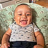 Kirk Jr joined the competition — help win amazing prizes! baby, smiling, happy, infant, clothing, blanket, dinosaur_pattern, indoor, cute, child, portrait, sitting, apparel, joyful, person, face, head, toddler, denim, furniture