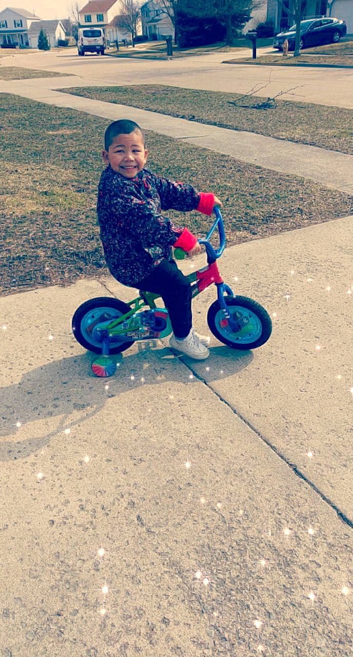 Kymani joined the competition — help win amazing prizes! auto_part, automotive_wheel_system, bicycle_accessory, child, cycling, fun, joy, mode_of_transport, person, play, recreation, toddler, training_wheels, tricycle, vehicle, wheel