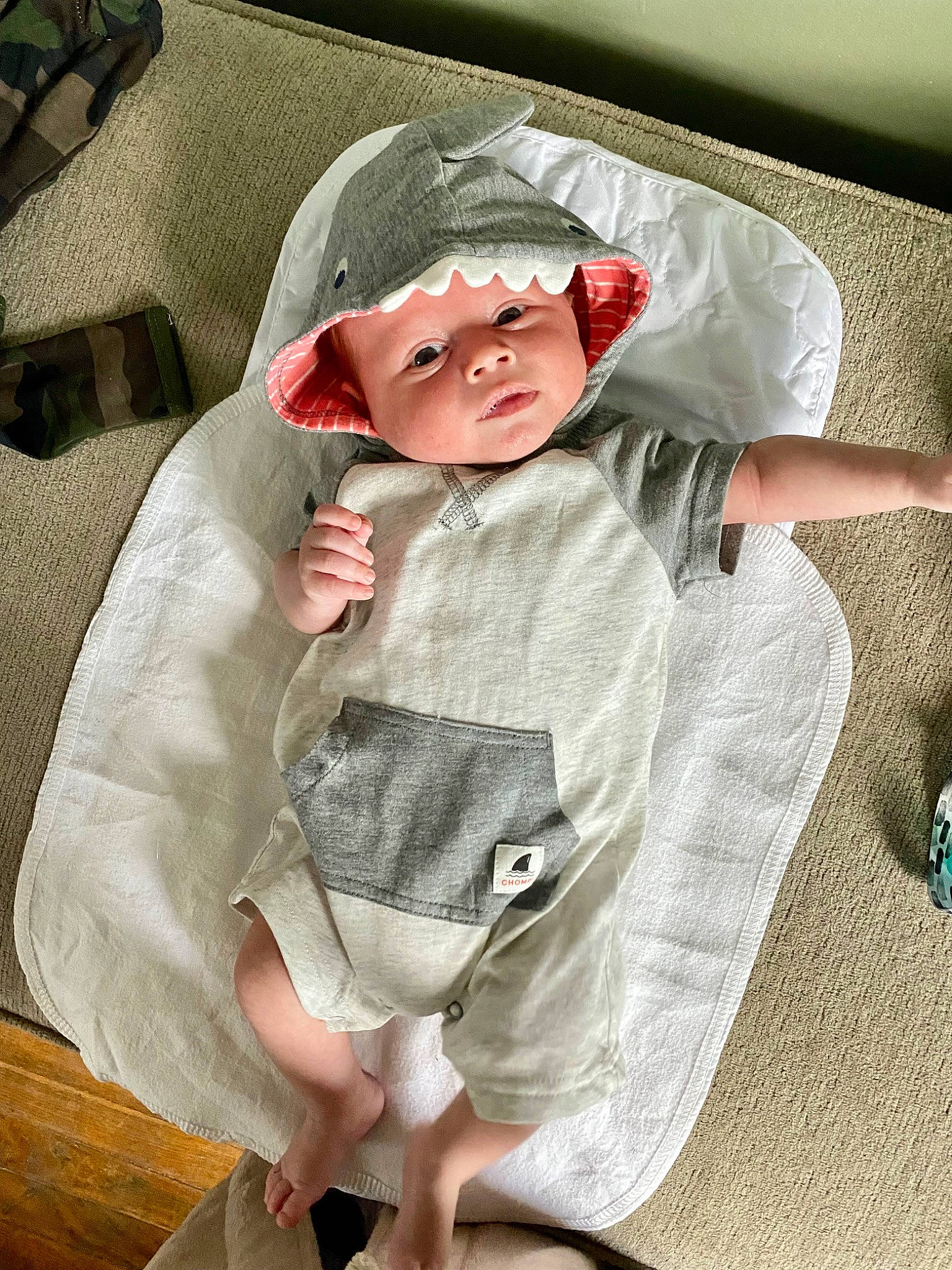 Judson is registered to the contest to win money with this photo: baby, baby_carriage, baby_products, baby_toddler_clothing, cap, cheek, child, collar, comfort, finger, flooring, headgear, headwear, linens, pattern, person, sitting, skin, sleeve, sunglasses