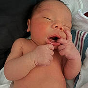 Zyion joined the competition — help win amazing prizes! newborn, baby, infant, sleeping, hand, fingers, mouth, skin, face, closeup, portrait, peaceful, wrapped, blanket, striped, soft, cute, tiny, resting, indoors
