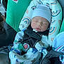Zyion joined the competition — help win amazing prizes! baby, newborn, car_seat, sleeping, infant, onesie, hat, safety_harness, headrest, patterned_clothing, dinosaur_print, child, seatbelt, cute, indoors, resting, soft_fabric, peaceful, person, toddler