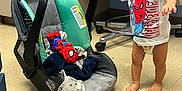 Zy'Aire joined the competition — help win amazing prizes! toddler, child, spiderman, tshirt, car_seat, plush_toy, blanket, barefoot, floor, cabinet, chair, indoor, smile, curly_hair, diaper, toy, person, baby_gear, hospital_room, playful