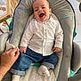 Elio participe au concours pour gagner de l'argent avec cette photo : baby, babylaughing, bodypart, chair, clothing, crib, cushion, face, finger, furniture, hand, happy, head, homedecor, infantbed, laughing, pants, person, photography, portrait