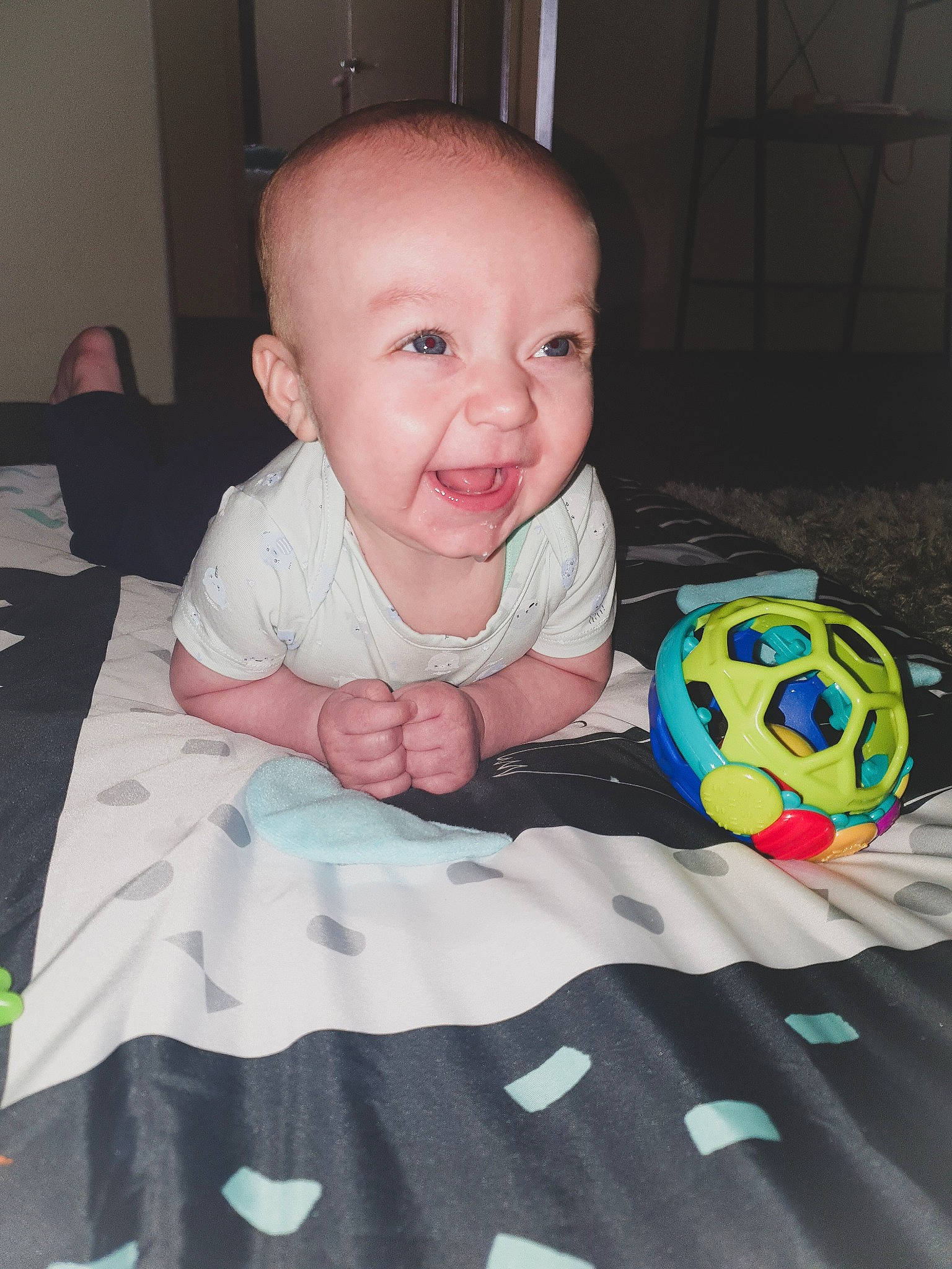 Arian joined the competition — help win amazing prizes! baby, baby_products, baby_toddler_clothing, baby_toys, ball, cheek, child, eye, face, fun, head, iris, person, play, room, sitting, skin, toddler, tummy_time