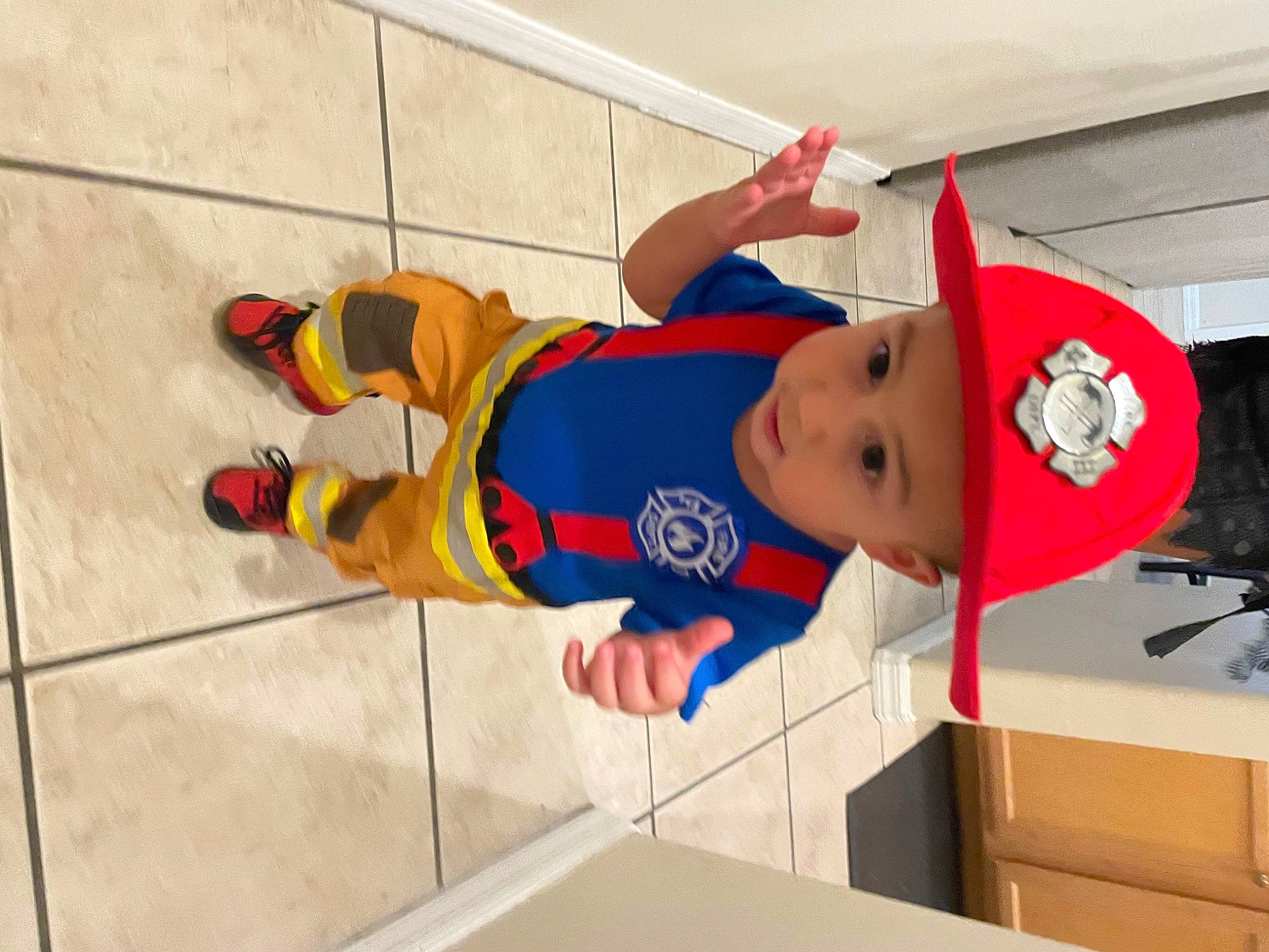 Bryce is registered to the contest to win money with this photo: baby, baby_toddler_clothing, baseball_cap, carmine, child, costume, elbow, fictional_character, flooring, fun, hat, headwear, knee, leisure, person, recreation, shorts, sportswear, sun_hat, t_shirt