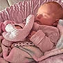 Savannah is registered to the contest to win money with this photo: baby, bedtime, blanket, child, clothing, comfort, cozy, cute, indoor, infant, newborn, pacifier, peaceful, pink, plush_toy, portrait, resting, sleeping, soft_texture, wrapped
