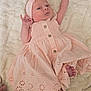 Savannah joined the competition — help win amazing prizes! baby, infant, dress, headband, pink, blanket, foot, hand, face, cute, newborn, sleepwear, soft, fabric, pattern, texture, resting, lying_down, portrait, child