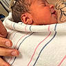 Soul is registered to the contest to win money with this photo: newborn, baby, infant, sleeping, blanket, striped_blanket, tattoo, hand, skin, closeup, portrait, person, resting, comfort, love, family, indoor, soft, newborn_baby, peaceful