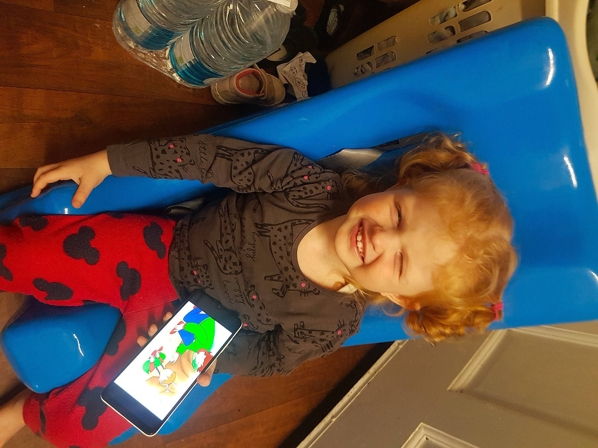 Ava is registered to the contest to win money with this photo: baby_products, baby_toys, blue, child, electric_blue, fun, head, joy, leisure, person, plastic, play, room, smile, t_shirt, toddler, toy, visual_arts