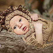 Samuel is registered to the contest to win money with this photo: baby, beanie, blanket, bodypart, bonnet, cap, clothing, face, finger, hand, happy, hat, head, knitwear, newborn, person, photography, portrait, smile, sweater