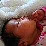 baby, sleeping, blanket, pink_clothing, infant, soft_texture, face, hand, cozy, closeup, child, newborn, peaceful, cute, portrait, rest, warm, fuzzy, comfort, toddler