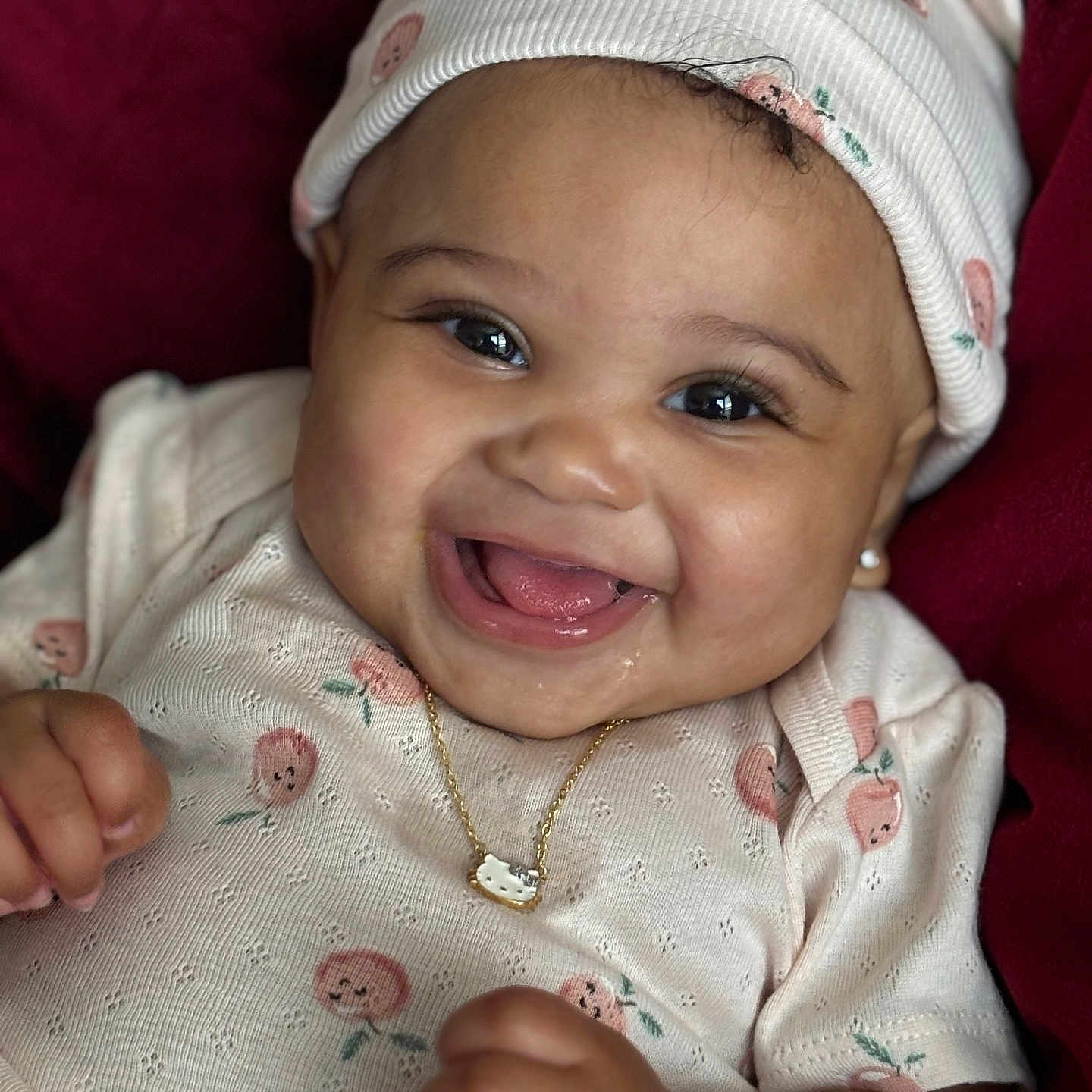 Mariah is registered to the contest to win money with this photo: accessories, baby, babylaughing, bodypart, cap, clothing, face, finger, hand, happy, hat, head, jewelry, laughing, necklace, newborn, person, photography, portrait, smile