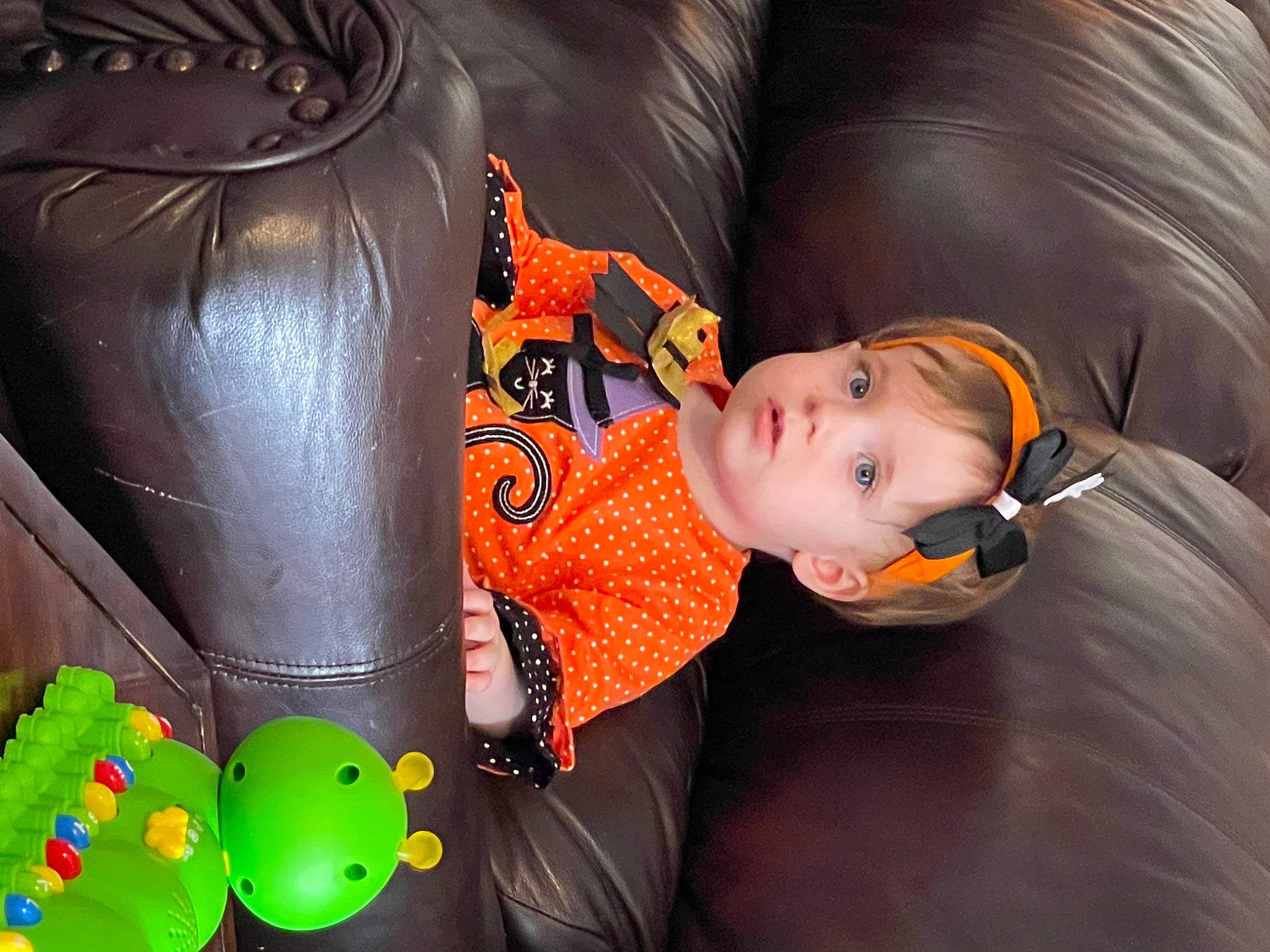 Rhys is registered to the contest to win money with this photo: baby, baby_products, baby_toddler_clothing, baby_toys, car_seat, child, comfort, flooring, fun, mammal, orange, person, personal_protective_equipment, product, room, sitting, stuffed_toy, toddler, toy, vertebrate