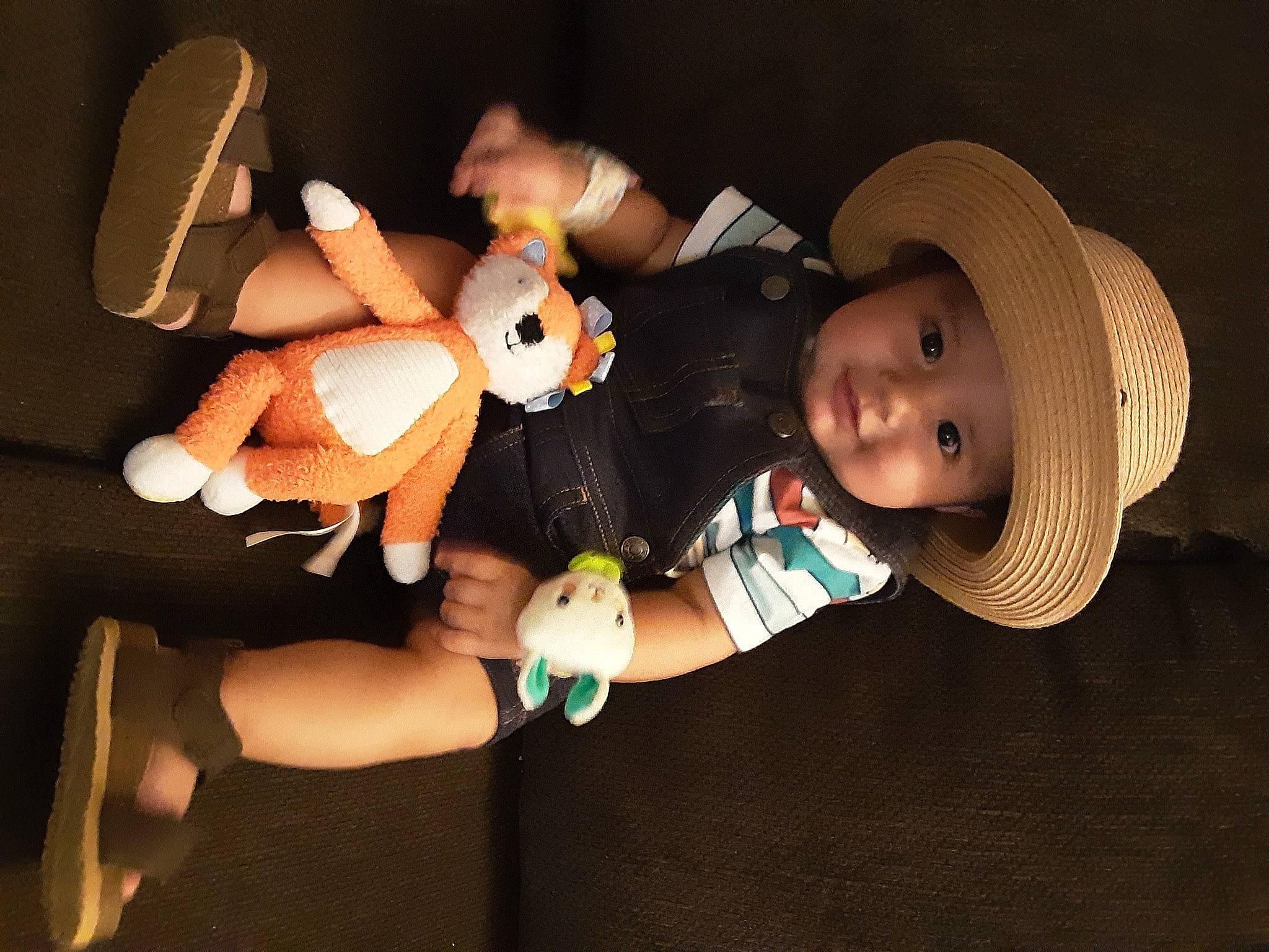 Noah is registered to the contest to win money with this photo: arm, baby, baby_toddler_clothing, child, eye, finger, flash_photography, fun, gesture, hand, hat, headwear, human_body, human_leg, person, product, skin, stuffed_toy, sun_hat, thumb