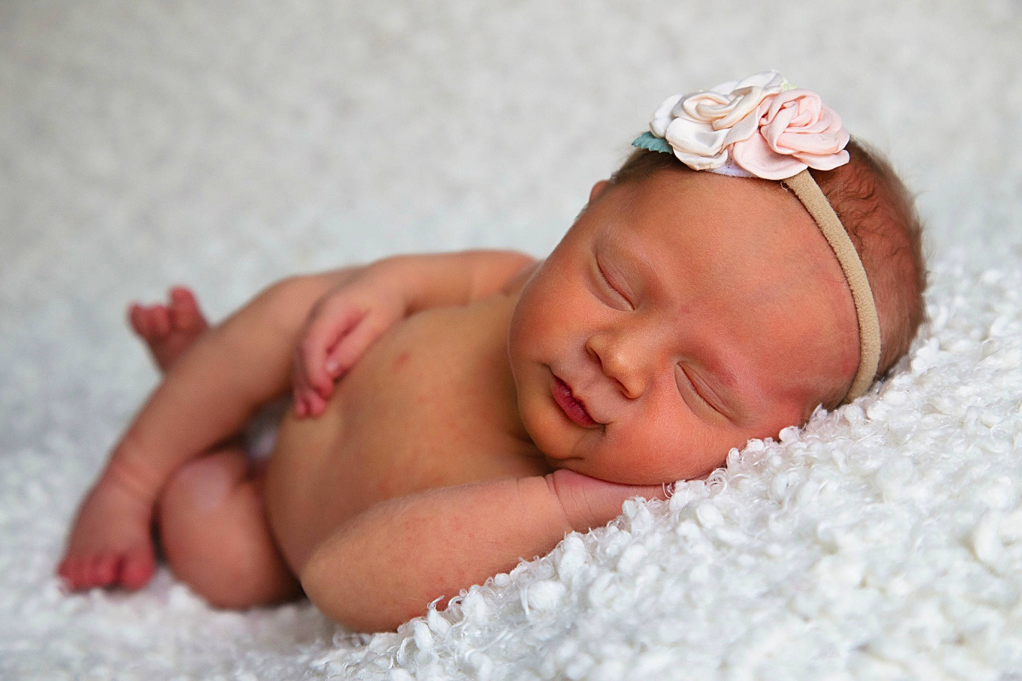 Georgia is registered to the contest to win money with this photo: baby, baby_sleeping, baby_toddler_clothing, bedtime, cheek, child, close_up, comfort, face, fashion_accessory, finger, flower, hand, headband, headgear, headpiece, linens, lip, person, skin