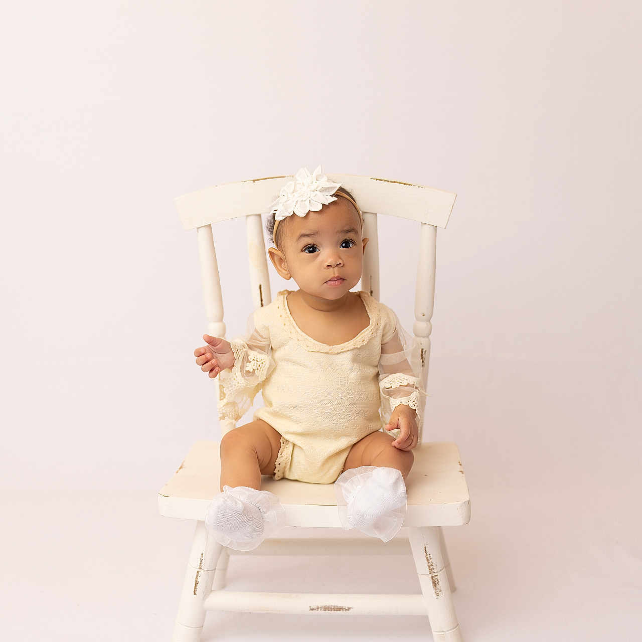 Airih is registered to the contest to win money with this photo: baby, bodypart, chair, clothing, crib, face, finger, furniture, hand, happy, hat, head, infantbed, person, photography, portrait, rockingchair, sitting, smile, wood
