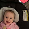 Hailey joined the competition — help win amazing prizes! baby, baby_seat, blanket, child, cushion, cute, digital_emoji, face, happy, heart_emoji, indoors, infant, person, pink_onesie, portrait, rainbow, screen, smiling, soft_furniture, young_child