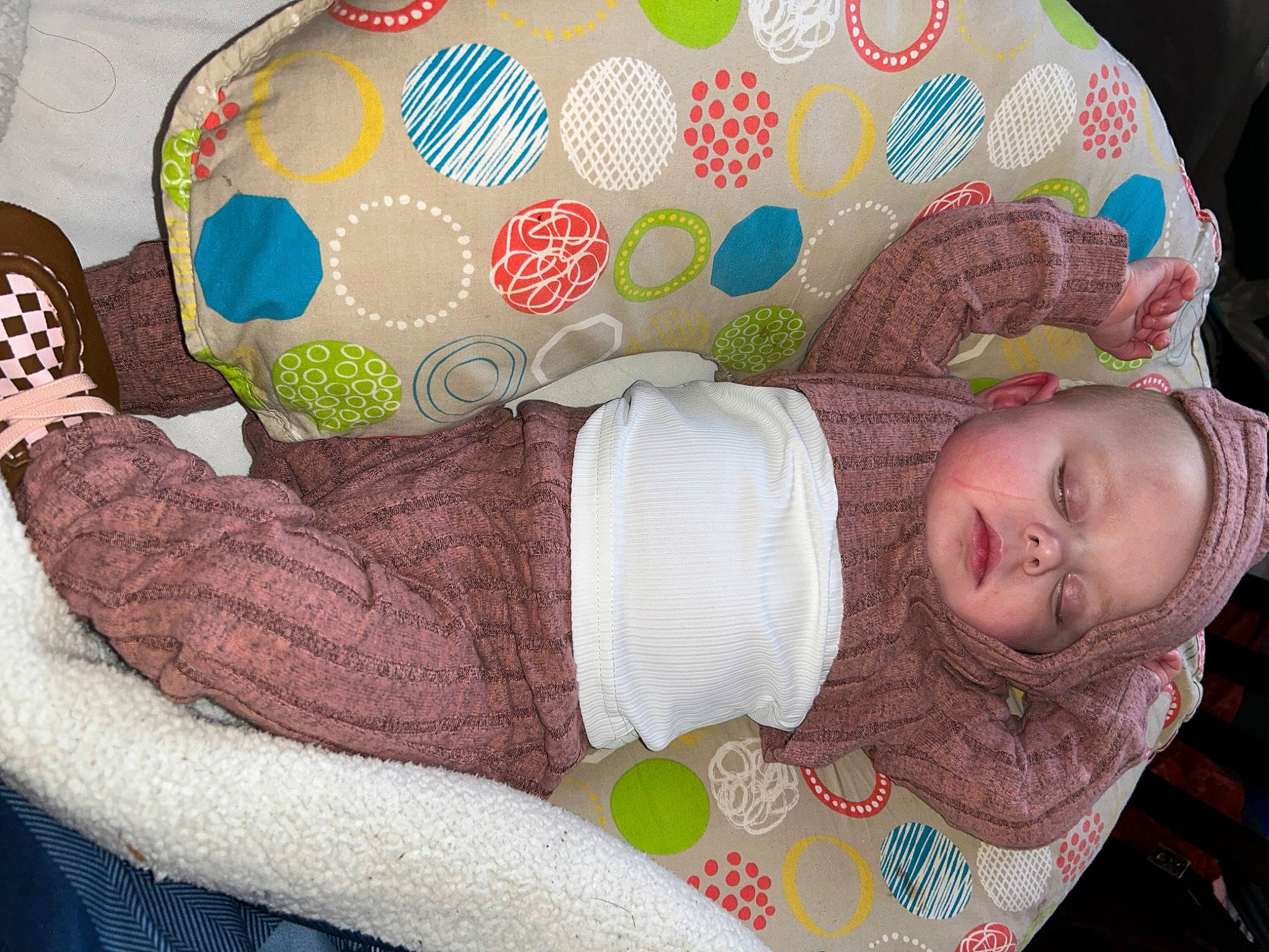 Callie is registered to the contest to win money with this photo: art, baby, baby_products, baby_sleeping, baby_toddler_clothing, bag, cheek, child, comfort, fashion_accessory, head, headgear, human_body, linens, pattern, person, sleeve, textile, toddler, wool