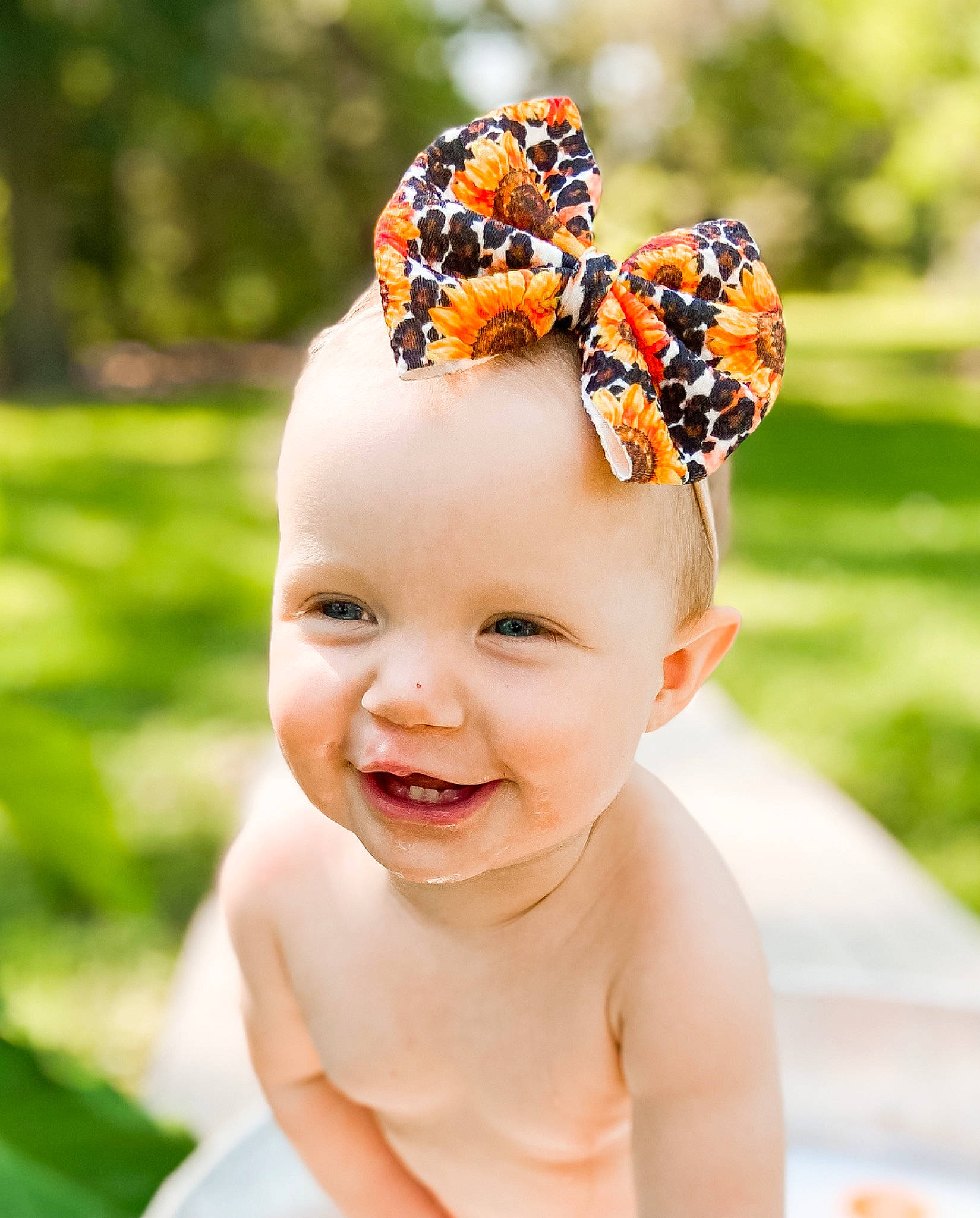 Allie-rae is registered to the contest to win money with this photo: arthropod, baby, baby_toddler_clothing, chest, child, fashion_accessory, grass, hair_accessory, hair_tie, happy, head, headband, headgear, headpiece, insect, jewellery, joy, people_in_nature, person, plant