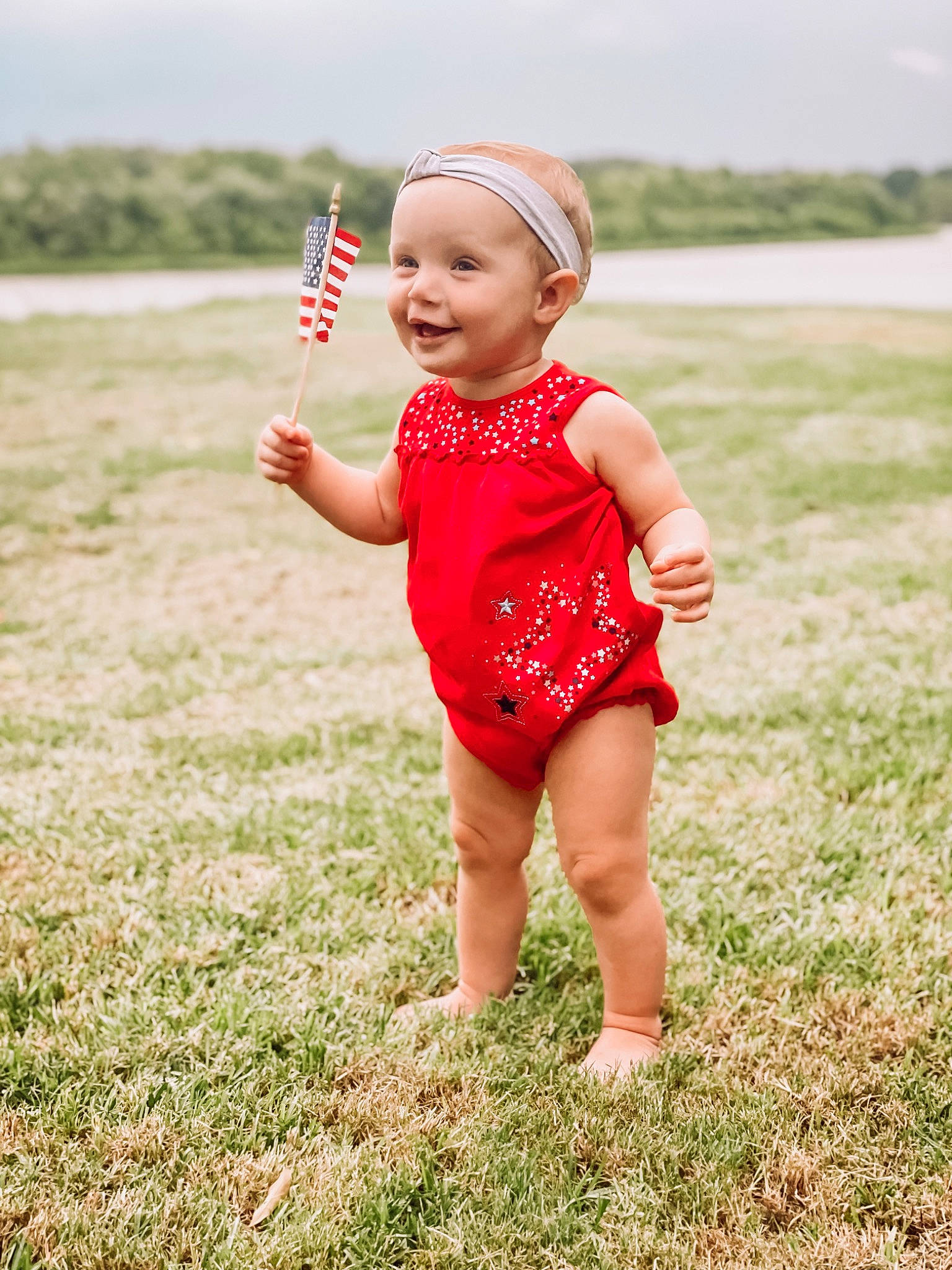 Allie-rae joined the competition — help win amazing prizes! arm, baby, baby_toddler_clothing, face, flash_photography, gesture, grass, grass_family, grassland, hand, happy, head, headwear, human_body, joy, meadow, people_in_nature, person, plant, recreation