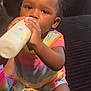 toddler, child, baby, drinking, milk_bottle, colorful_clothing, striped_outfit, curly_hair, indoors, sitting, person, face, hand, milk, cute, young_child, portrait, infant, skin, expression