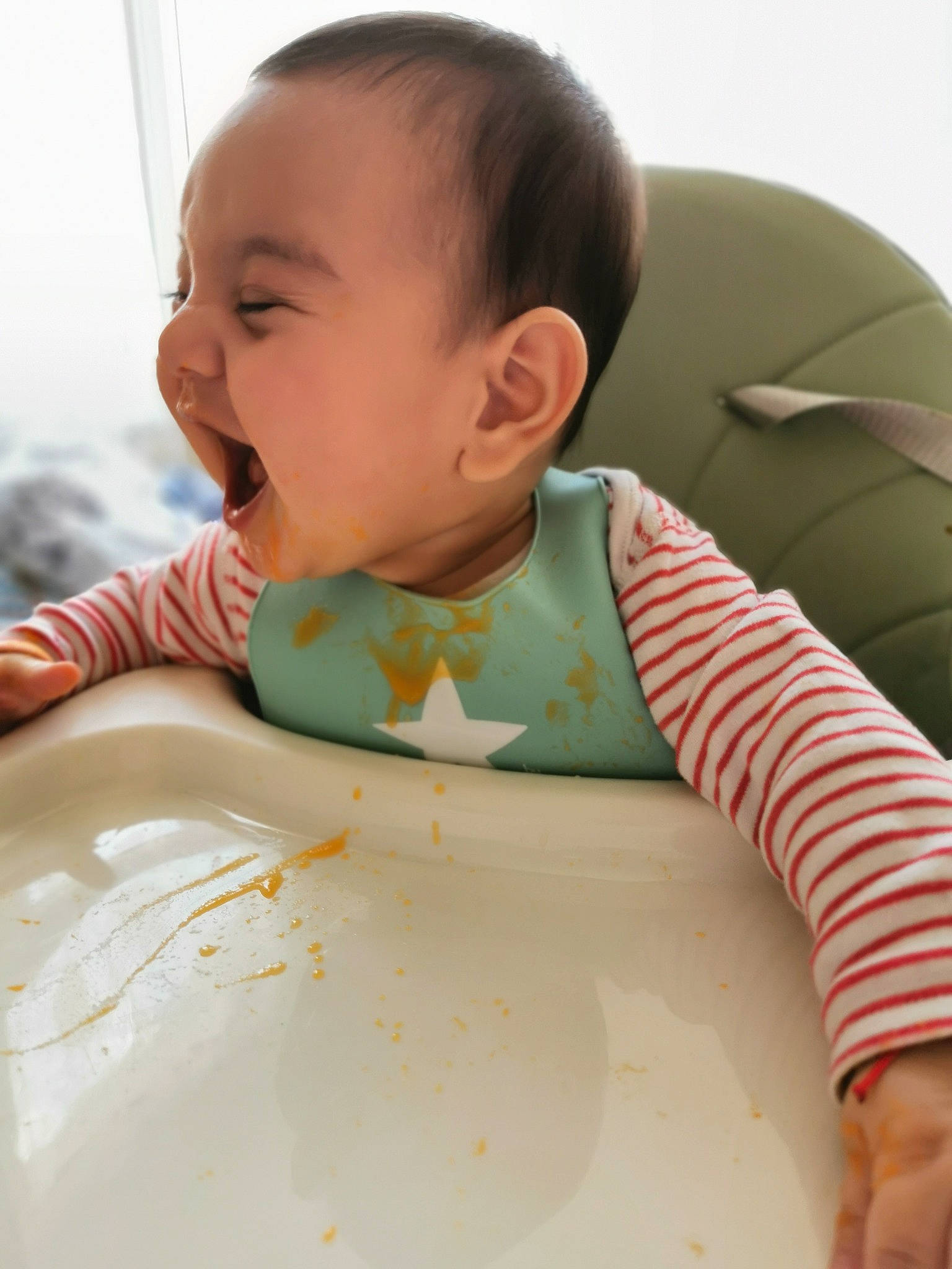 Ayan joined the competition — help win amazing prizes! baby, baby_toddler_clothing, bib, chair, cheek, child, chin, comfort, cup, dishware, drinkware, facial_expression, happy, person, plate, serveware, sitting, skin, sleeve, tableware
