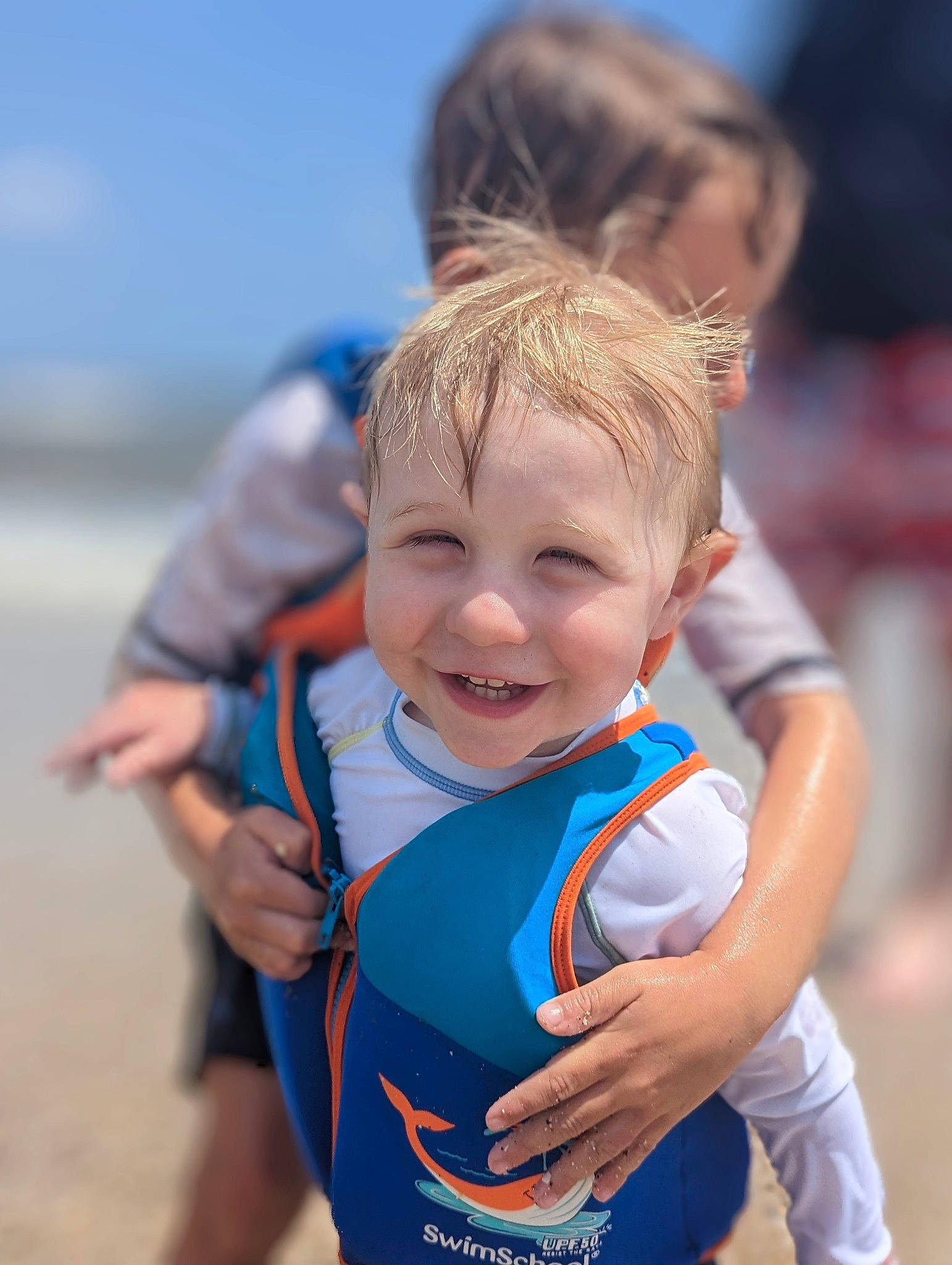 Ollie joined the competition — help win amazing prizes! athlete, beach, child, competition_event, electric_blue, endurance_sports, facial_expression, fun, gesture, happy, joy, leisure, ocean, people_in_nature, person, personal_protective_equipment, play, recreation, running, smile