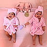 babies, twins, infants, smiling, pink, bathrobes, towels, turbans, bunny_toys, nursery, milestone, six_months, portrait, indoor, lying_down, baby_care, blanket, happy, siblings, photography