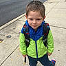 Jaxson joined the competition — help win amazing prizes! child, boy, young, portrait, outdoor, sidewalk, street, backpack, superhero, jacket, green_clothing, blue_clothing, sneakers, standing, smiling, face, short_hair, urban, daylight, photography
