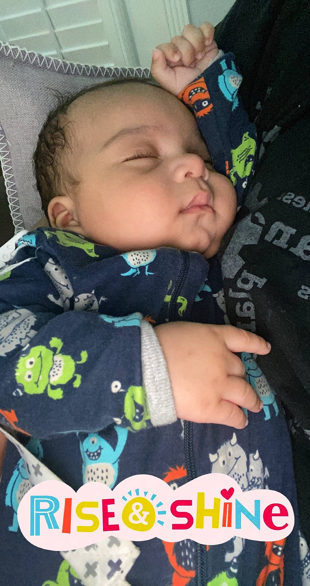 Kieran is registered to the contest to win money with this photo: baby, baby_products, baby_toddler_clothing, cheek, child, comfort, cool, face, facial_expression, green, happy, outerwear, pattern, people, person, photograph, sitting, sleeve, snapshot, t_shirt