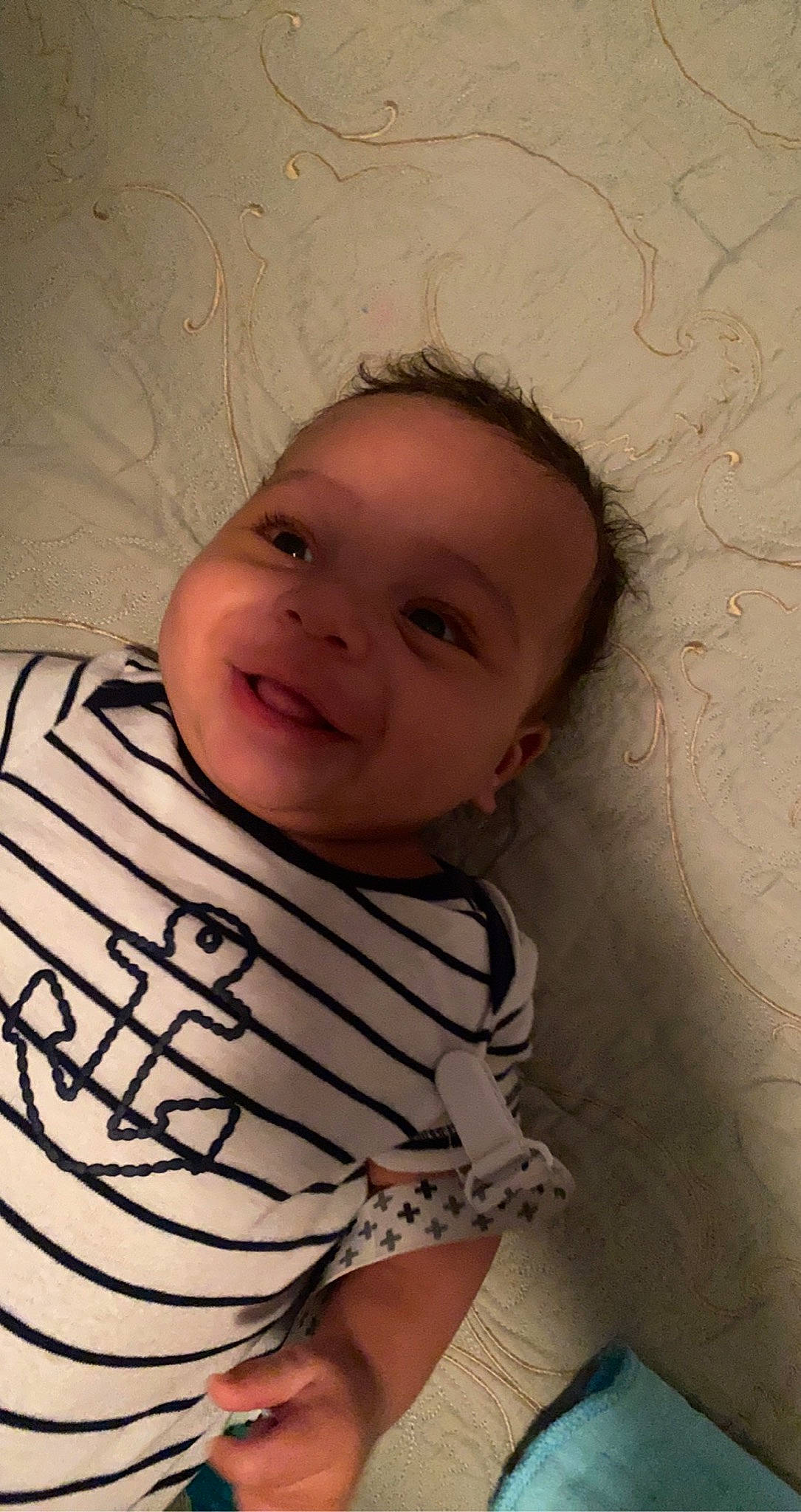 Kieran is registered to the contest to win money with this photo: baby, cheek, chin, eye, eyebrow, face, finger, forehead, happy, head, human_body, iris, lip, mouth, neck, nose, person, skin, sleeve, smile