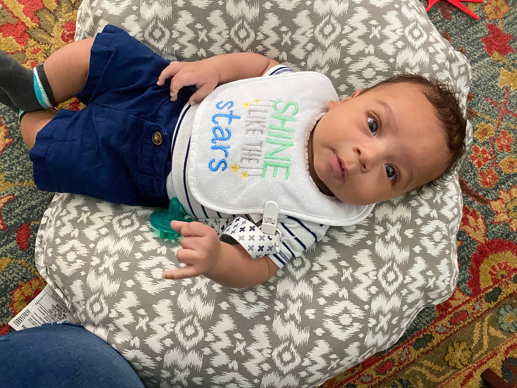 Kieran is registered to the contest to win money with this photo: arm, baby, baby_products, baby_toddler_clothing, bedtime, child, comfort, grass, green, happy, human_leg, linens, nap, pattern, person, sitting, sleeve, t_shirt, thigh, toddler