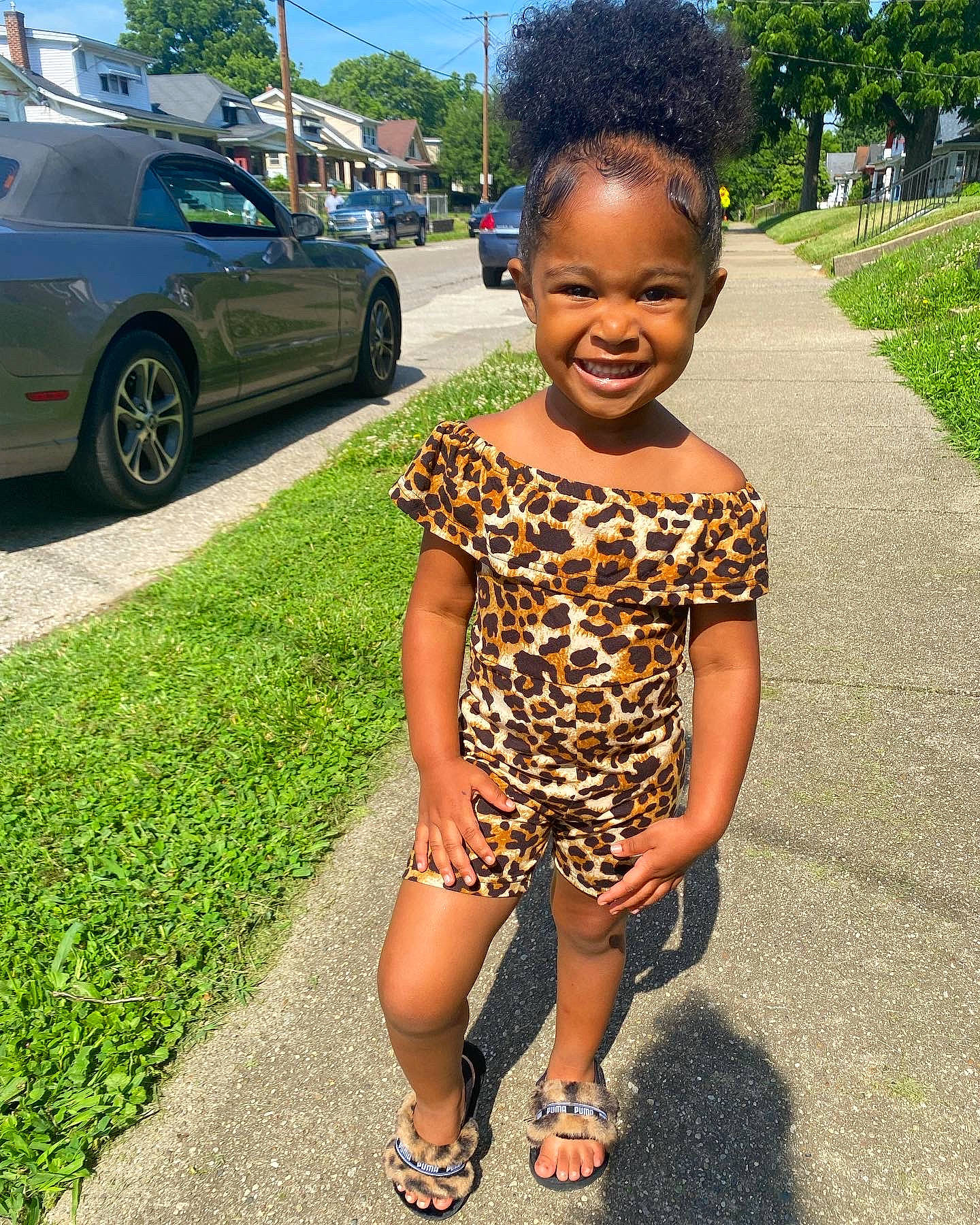 Reigna joined the competition — help win amazing prizes! asphalt, automotive_tire, car, eye, grass, green, happy, joy, motor_vehicle, person, personal_luxury_car, plant, road, sandal, sky, smile, tire, toddler, tree, vehicle