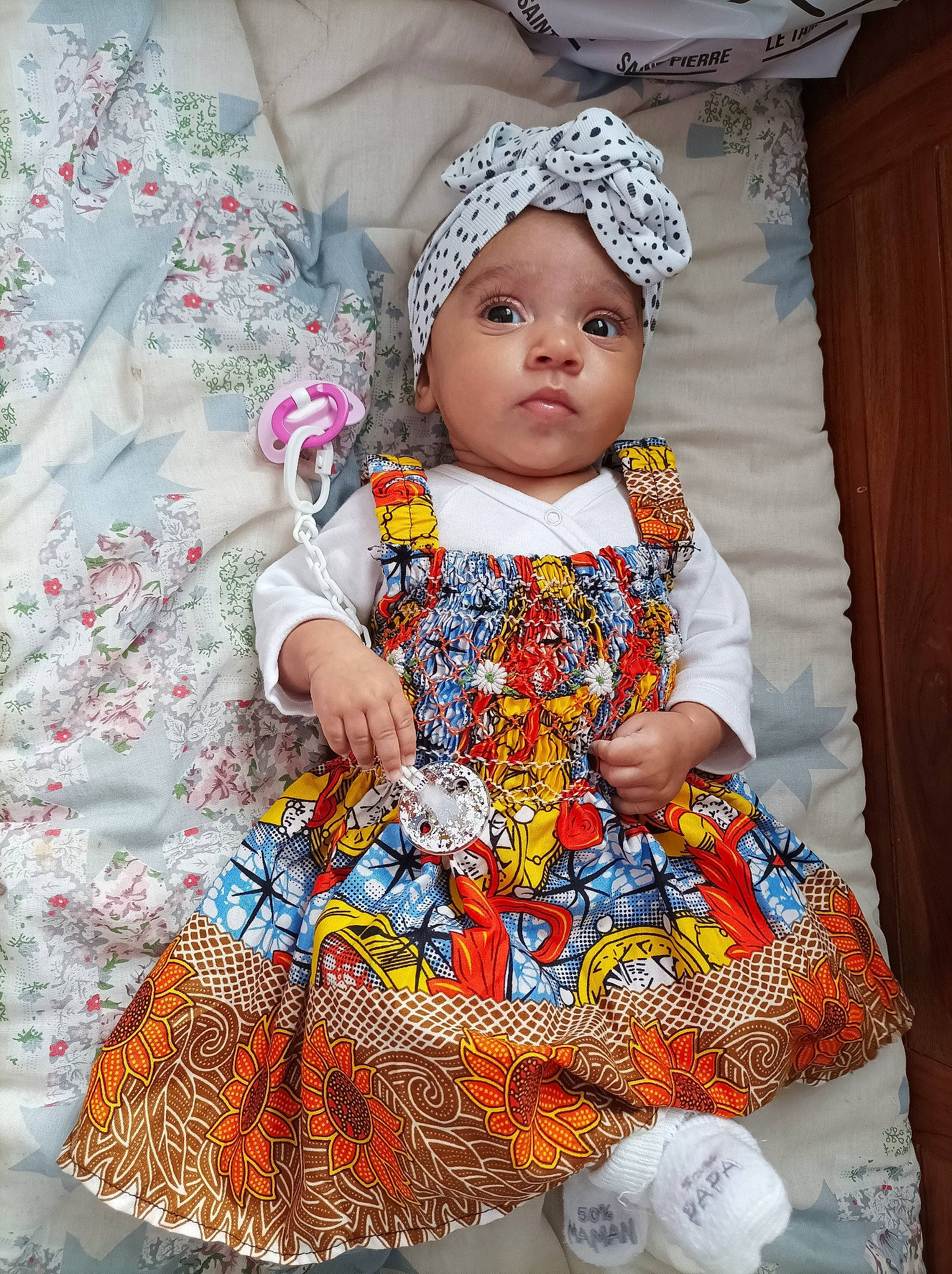 Mencya participe au concours pour gagner de l'argent avec cette photo : baby, baby_products, baby_toddler_clothing, cap, child, day_dress, dress, event, fashion_accessory, fashion_design, headwear, magenta, one_piece_garment, outerwear, pattern, person, pink, product, sleeve, t_shirt