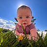 baby, blanket, blue_sky, child, clothing, cute, daylight, flower, grass, greenery, infant, looking_at_camera, nature, one_person, outdoor, person, portrait, sky, sunlight, tree