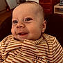 élias a rejoint le concours — aidez-le/la à gagner de superbes lots ! baby, infant, smile, closeup, striped_onesie, cheeks, eyes, portrait, indoor, furniture, dresser, refrigerator, warm_lighting, seat, head, ear, skin, happy, clothing, cute