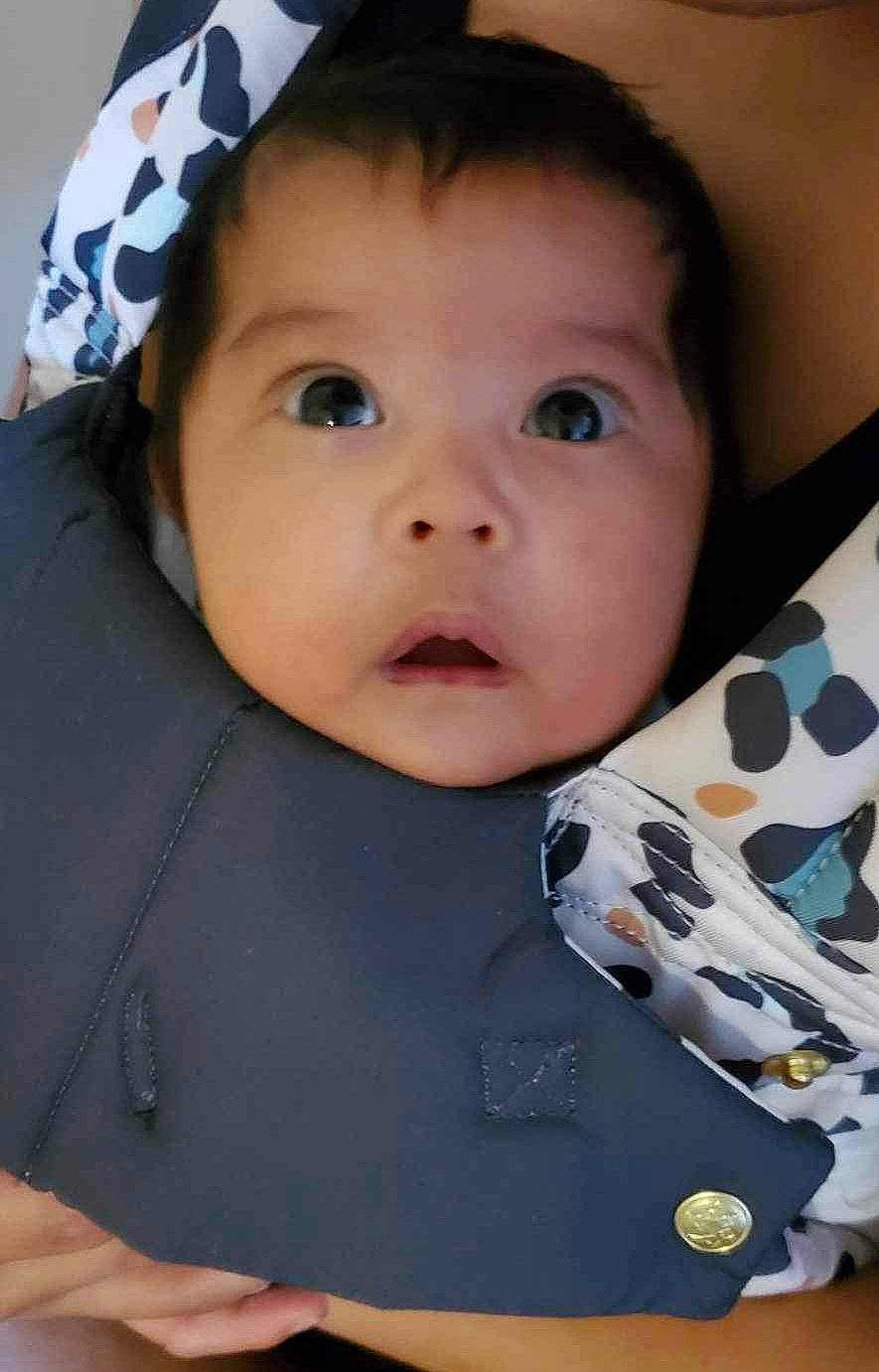 Emma is registered to the contest to win money with this photo: baby, baby_toddler_clothing, cap, cheek, child, costume_hat, facial_expression, happy, nose, outerwear, pattern, person, plaid, portrait_photography, sitting, skin, sleeve, smile, t_shirt, toddler