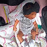 Ja'Zyiah joined the competition — help win amazing prizes! baby, infant, blanket, car_seat, headband, bow, white_socks, pacifier, clothing, sleeping, cute, newborn, soft, colorful, patterned_blanket, resting, indoors, child, peaceful, wrapped