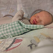 Michael joined the competition — help win amazing prizes! newborn, baby, sleeping, blanket, soft, patterned, cozy, infant, wrapped, peaceful, closeup, indoors, cute, resting, face, child, bed, comfort, warm, portrait