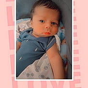 Ny'Sir is registered to the contest to win money with this photo: baby, baby_bed, blanket, blue_clothing, child, close_up, crib, cute, eyes, face, indoor, infant, looking_at_camera, love_text, lying_down, photo_frame, photography, pink_background, portrait, sitting