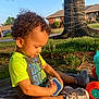 Zaelyn joined the competition — help win amazing prizes! toddler, child, curly_hair, toy, playing, outdoor, grass, tree, sunlight, blanket, sneakers, green_shirt, suburban, house, daytime, side_view, nature, young_child, summer, fun