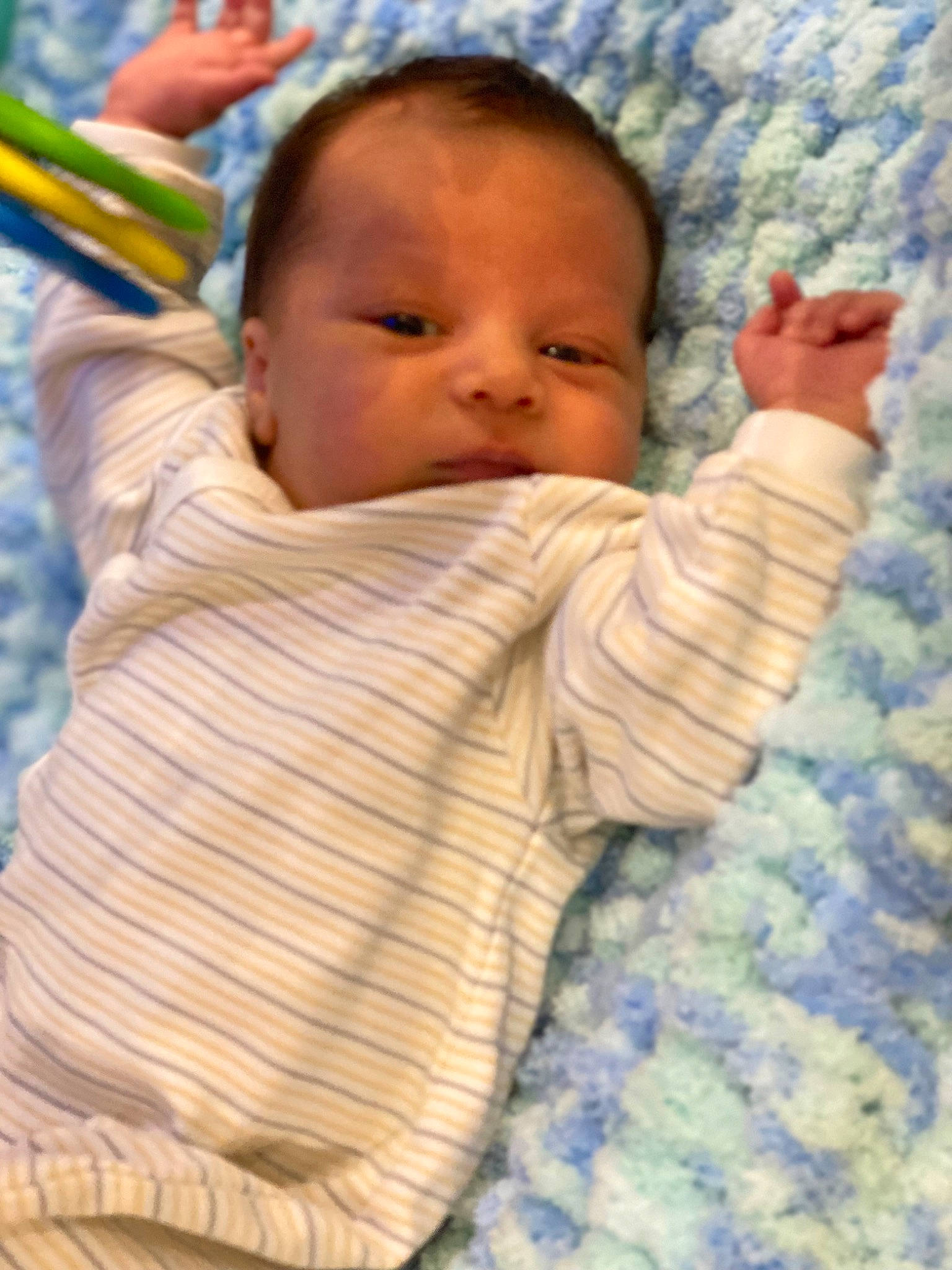 Gage is registered to the contest to win money with this photo: baby, baby_products, baby_toddler_clothing, cheek, child, comfort, eye, finger, gesture, grass, happy, iris, linens, nose, people_in_nature, person, skin, textile, thumb, toddler