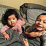 child, baby, toddler, bed, blanket, pillow, smile, face, hair, indoors, person, clothing, cute, happy, sibling, family, cozy, resting, portrait, young